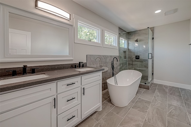 bathroom with vanity and plus walk in shower