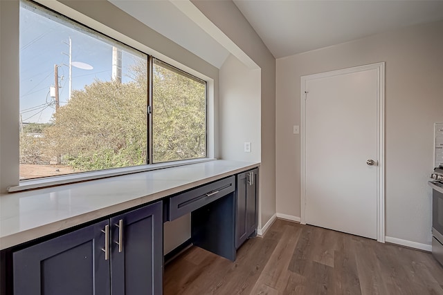 kitchen featuring a wealth of natural light and light hardwood / wood-style flooring