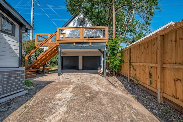 garage with wooden walls and central air condition unit