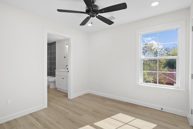 spare room with ceiling fan and light hardwood / wood-style flooring