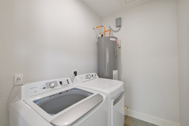 clothes washing area with separate washer and dryer and water heater