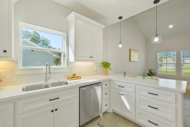 kitchen with pendant lighting, sink, white cabinets, stainless steel dishwasher, and kitchen peninsula