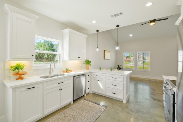 kitchen with sink, kitchen peninsula, pendant lighting, stainless steel appliances, and white cabinets