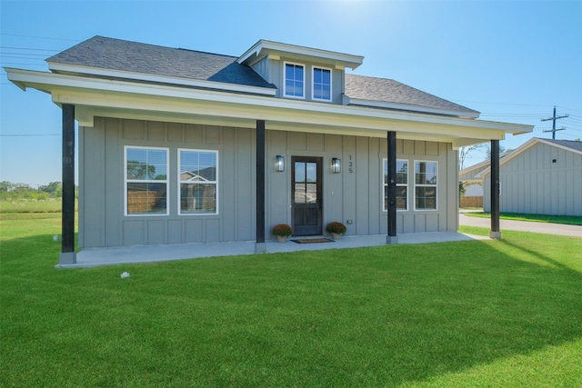 view of front of house featuring a porch and a front yard