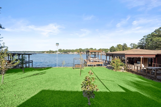 view of dock featuring a water view and a lawn