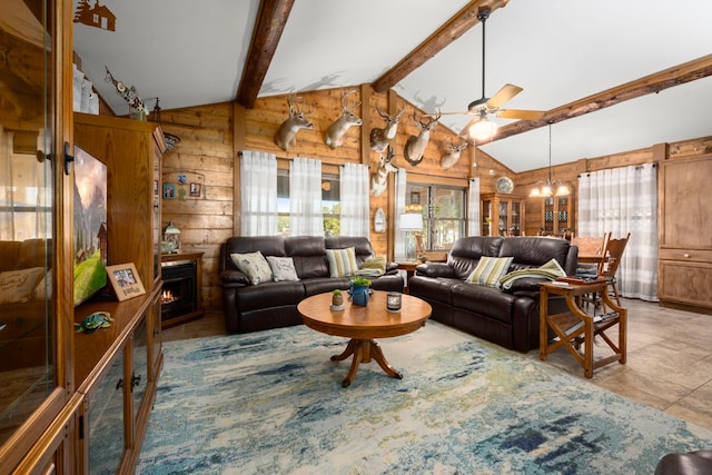 living room with rustic walls, wooden walls, vaulted ceiling with beams, and ceiling fan with notable chandelier