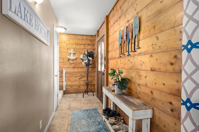 mudroom with wooden walls