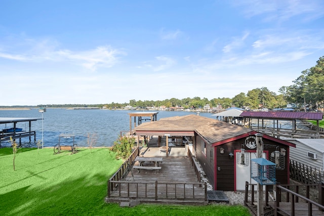 dock area featuring a water view and a lawn