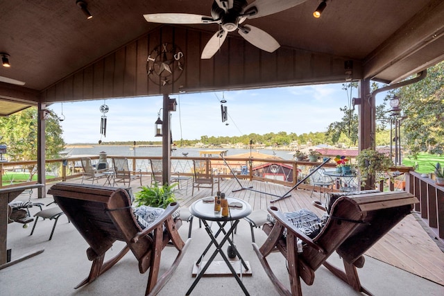 view of patio / terrace with ceiling fan and a water view