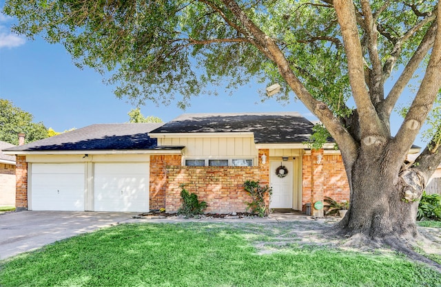 ranch-style home with a front yard and a garage