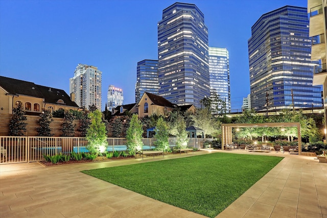 view of community with a patio and a yard