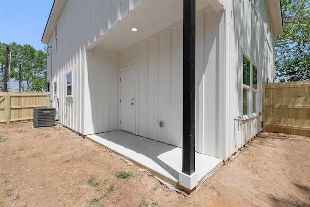 1310 E Alamo St A-B, Unit A-B Brenham, TX 77833 - view of property exterior with cooling unit, a patio, and fence