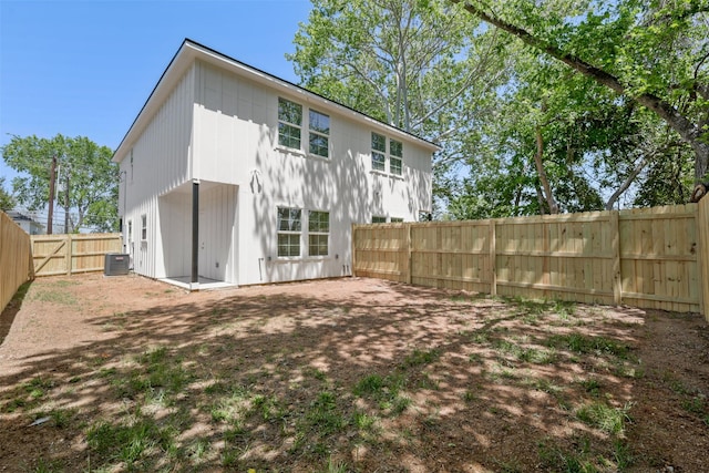 1310 E Alamo St A-B, Unit A-B Brenham, TX 77833 - rear view of property featuring a fenced backyard and central air condition unit