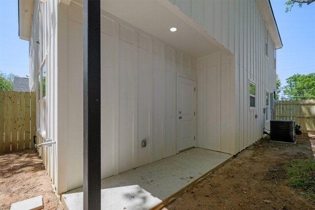 1310 E Alamo St A-B, Unit A-B Brenham, TX 77833 - entrance to property with central air condition unit and fence