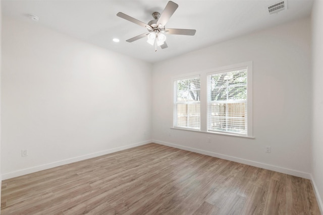 1310 E Alamo St A-B, Unit A-B Brenham, TX 77833 - spare room featuring visible vents, baseboards, light wood finished floors, and a ceiling fan