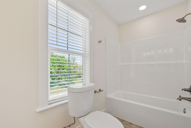 1310 E Alamo St A-B, Unit A-B Brenham, TX 77833 - bathroom featuring plenty of natural light, shower / tub combination, toilet, and wood finished floors