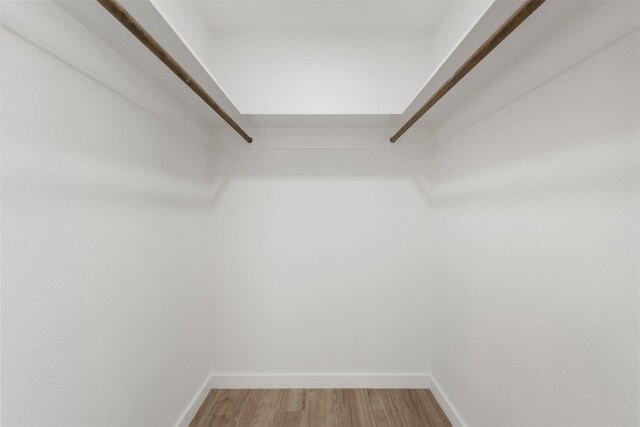 1310 E Alamo St A-B, Unit A-B Brenham, TX 77833 - walk in closet featuring light wood-type flooring