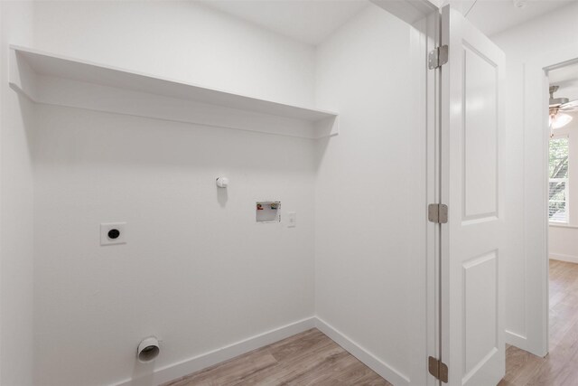 1310 E Alamo St A-B, Unit A-B Brenham, TX 77833 - laundry area with hookup for an electric dryer, baseboards, light wood-style flooring, laundry area, and hookup for a washing machine