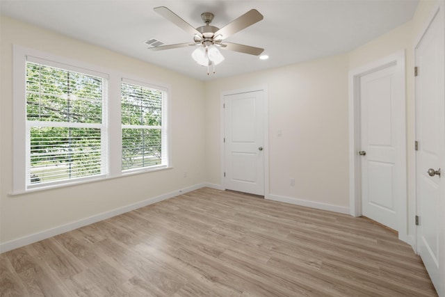 1310 E Alamo St A-B, Unit A-B Brenham, TX 77833 - unfurnished room featuring visible vents, baseboards, light wood finished floors, and ceiling fan
