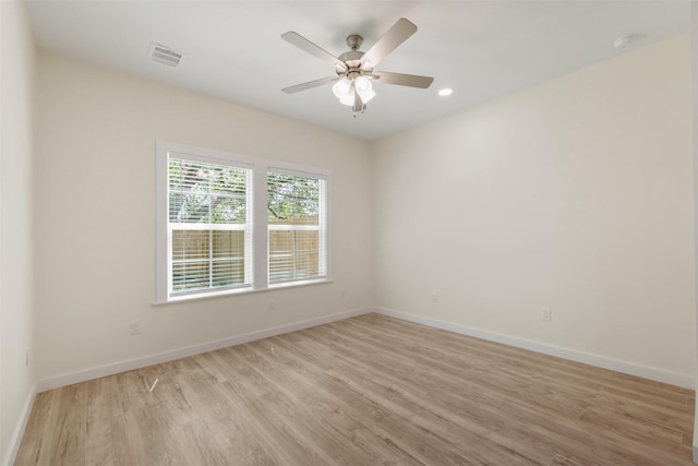 1310 E Alamo St A-B, Unit A-B Brenham, TX 77833 - unfurnished room with light wood-style floors, baseboards, and a ceiling fan