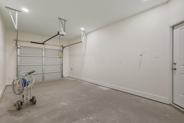 1310 E Alamo St A-B, Unit A-B Brenham, TX 77833 - garage featuring baseboards and a garage door opener