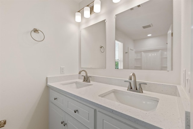 1310 E Alamo St A-B, Unit A-B Brenham, TX 77833 - full bath with a sink, visible vents, and double vanity