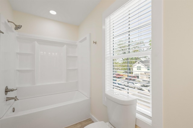 1310 E Alamo St A-B, Unit A-B Brenham, TX 77833 - bathroom with toilet, shower / tub combination, and wood finished floors