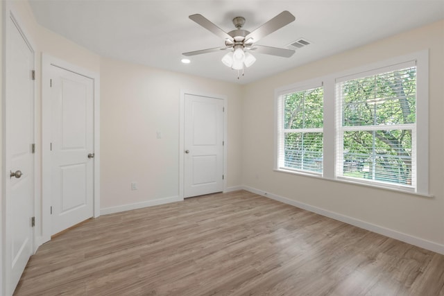 1310 E Alamo St A-B, Unit A-B Brenham, TX 77833 - unfurnished bedroom featuring visible vents, baseboards, and multiple windows