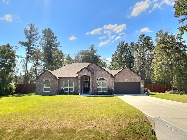 view of front of house featuring a front lawn and a garage