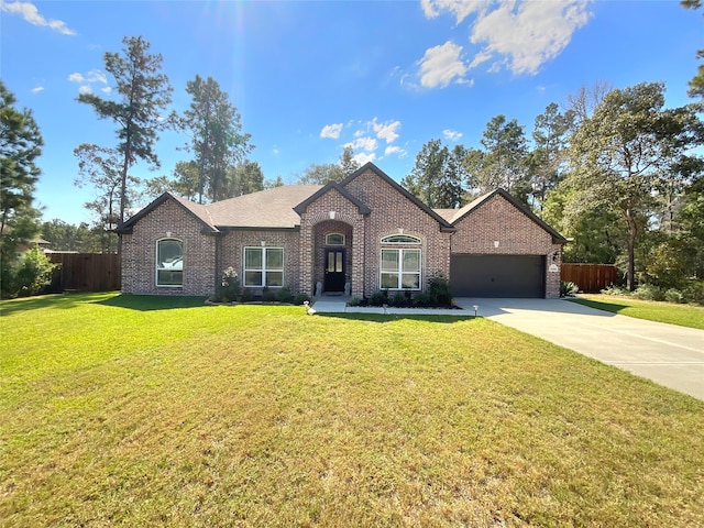 view of front facade with a garage and a front yard