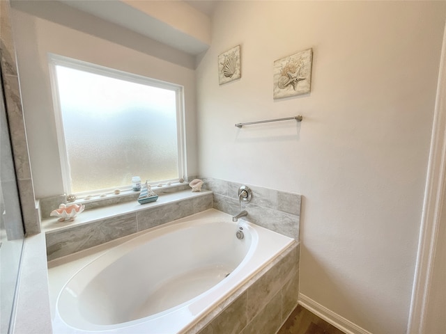 bathroom with tiled bath