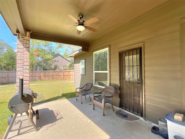 view of patio with area for grilling and ceiling fan