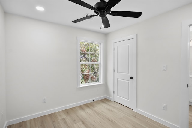 unfurnished room featuring ceiling fan and light hardwood / wood-style floors