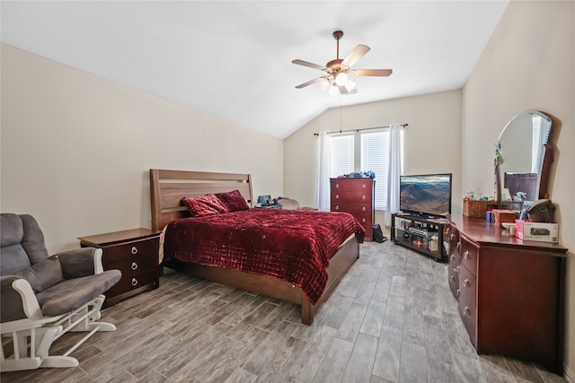 bedroom with lofted ceiling, light wood-type flooring, and ceiling fan