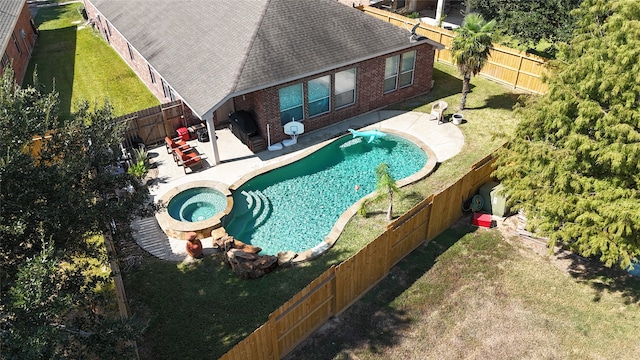 view of swimming pool with a patio, an in ground hot tub, and a lawn