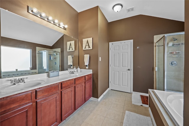 bathroom with vanity, lofted ceiling, shower with separate bathtub, and tile patterned floors