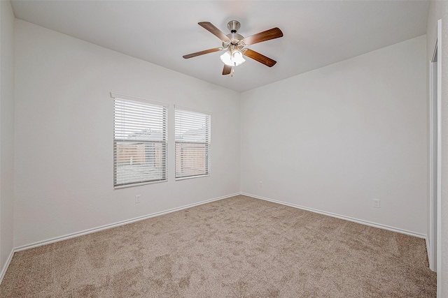 unfurnished room with ceiling fan and carpet floors