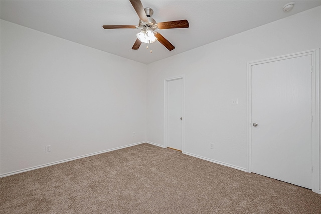 carpeted empty room with ceiling fan