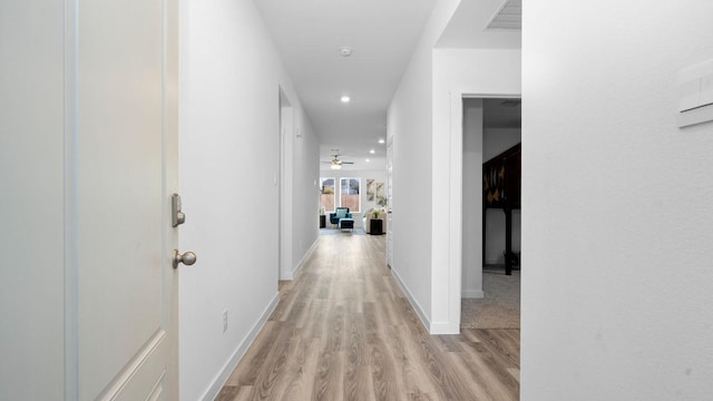 hallway featuring light hardwood / wood-style flooring