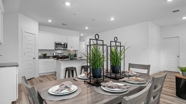 dining room featuring light hardwood / wood-style flooring