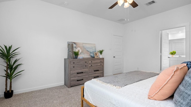 carpeted bedroom featuring ensuite bath and ceiling fan