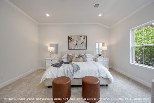 carpeted bedroom featuring ornamental molding, multiple windows, and vaulted ceiling