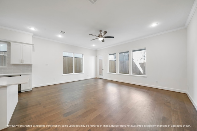 unfurnished living room with ceiling fan, crown molding, and dark wood-type flooring