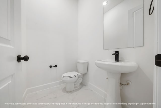 bathroom featuring toilet