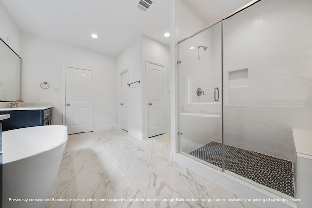 bathroom featuring plus walk in shower and vanity