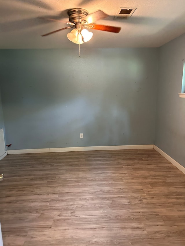 unfurnished room with light hardwood / wood-style flooring and ceiling fan