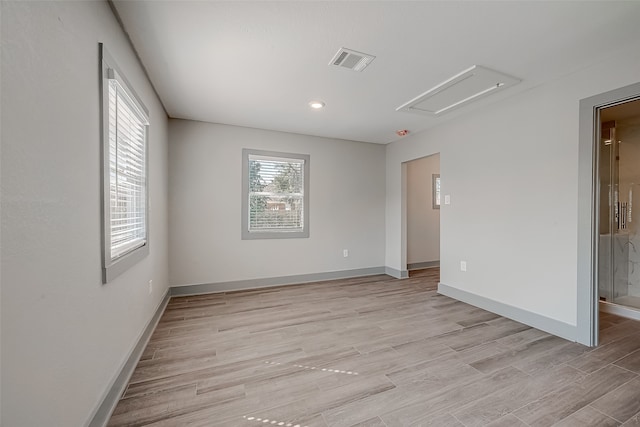 spare room with light wood-type flooring