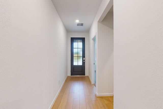 entryway with light hardwood / wood-style flooring