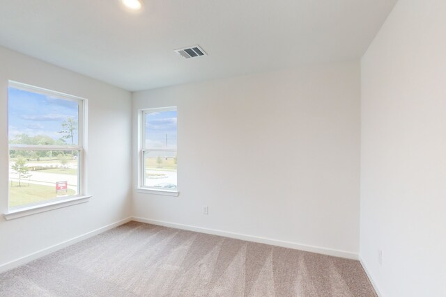 unfurnished room featuring carpet flooring