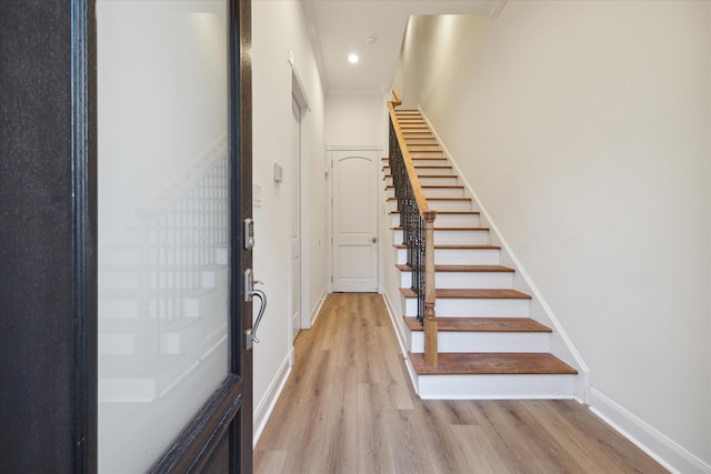 staircase featuring wood-type flooring